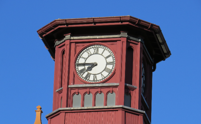 A clock tower in Merthyr Tydfil, coloured maroon